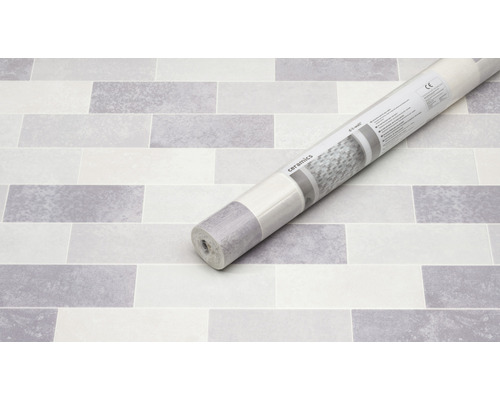 Rolle mit keramischer Wandverkleidung auf Steintapete