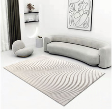 Wohnzimmer mit Teppich mit Wellenmuster, Sofa und Sessel
