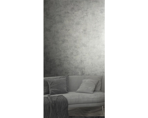 Wohnzimmer mit Betonwand und Sofa