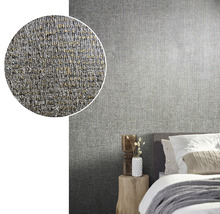 Schlafzimmer mit grauer Textiltapete an der Wand