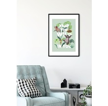 Gerahmtes Dschungelbuch-Poster mit der Aufschrift Keep the Wild in You über einem Sessel