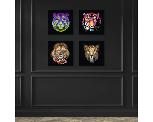 Vier Tierbilder an einer Wand: Tiger, Löwe und Leopard