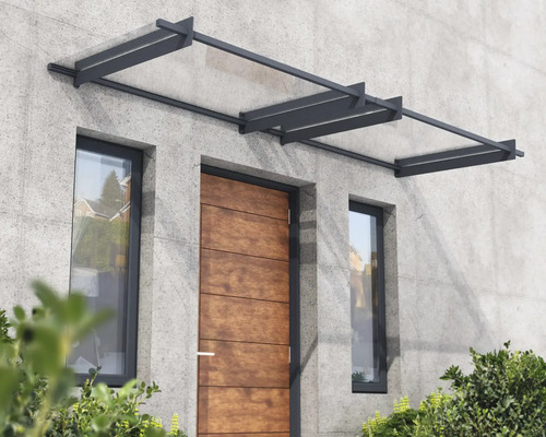 Haustürvordach aus Glas und Metall an einer Hausfassade