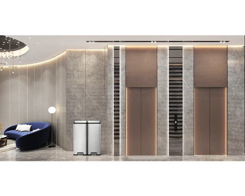 Mülleimer aus Edelstahl mit zwei Fächern in einem modern gestalteten Raum.