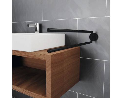 Waschbecken mit Unterschrank und schwenkbarem Handtuchhalter im Badezimmer