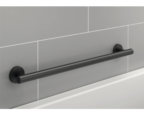 Schwarzer Haltegriff zur Badmontage an grauer Wand