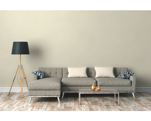 Wohnzimmer mit Ecksofa, Stehlampe und Couchtisch