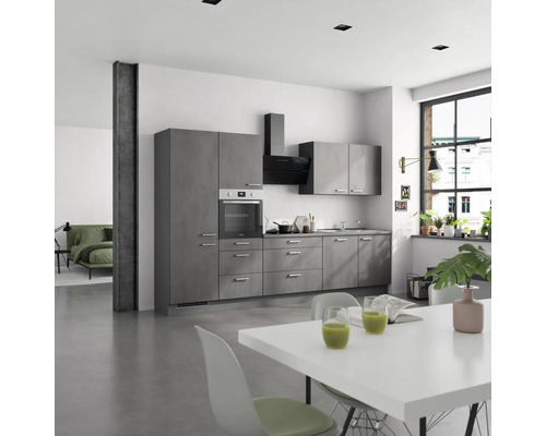 Moderne Küche mit grauen Schränken, Dunstabzugshaube und weißem Esstisch.