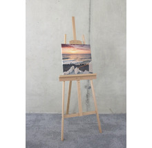 Staffelei mit Leinwandbild einer Meereslandschaft
