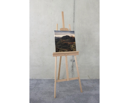 Staffelei mit Berglandschaft Leinwanddruck