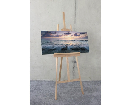 Staffelei mit Leinwandbild einer Meereslandschaft