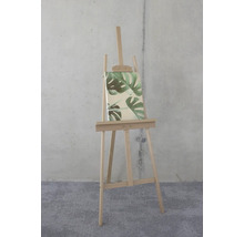 Holzstaffelei mit Leinwand und Monstera-Blatt-Motiv