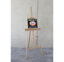 Staffelei mit einem Bild von einem Donut mit dem Text ''Donut Give Up''