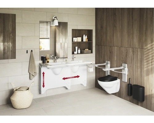 Barrierefreies Badezimmer mit Waschtisch und WC mit Haltegriffen.