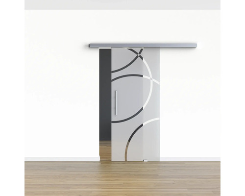 Schiebetür aus Glas mit Kreismuster vor einer Wand