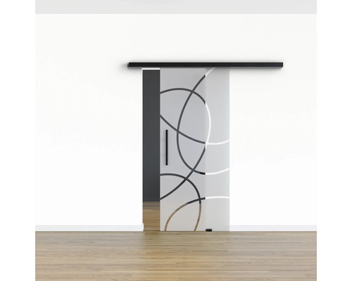 Schiebetür aus Glas mit kreisförmigem Muster vor einer Wand