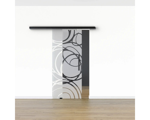 Schiebetür aus Glas mit Kreismuster vor einer weißen Wand