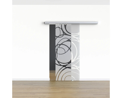 Schiebetür aus Glas mit Kreismuster vor weißer Wand