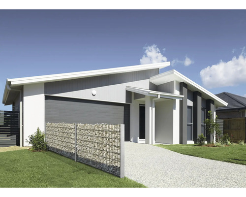 Einfamilienhaus mit Gabionenzaun zur Grundstücksbegrenzung