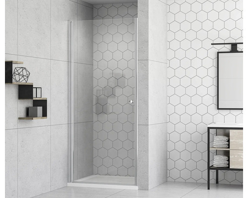 Badezimmer mit Duschkabine aus Glas und weißen sechseckigen Fliesen.