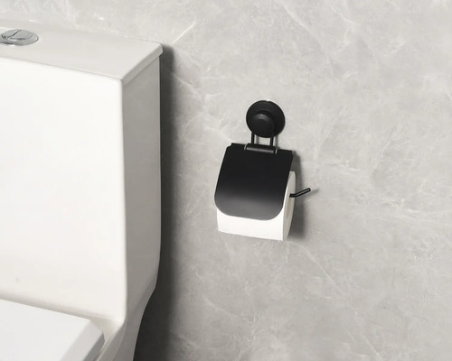 Toilettenpapierhalter mit Saugnapf neben Toilette