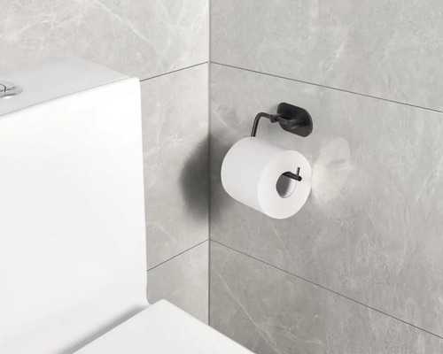 Toilettenpapierhalter mit Toilettenpapier an einer Badezimmerwand