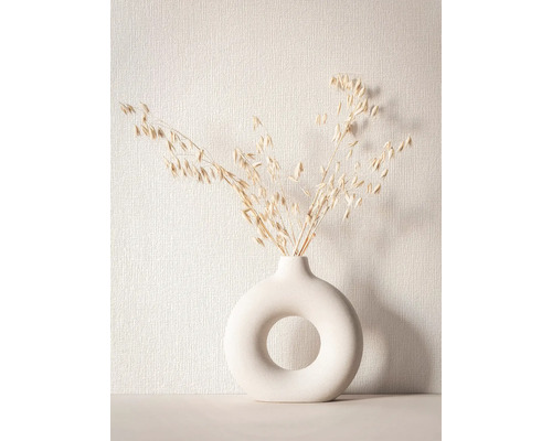 Dekorative Trockenblumen in einer runden Vase mit Öffnung