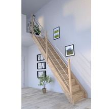 Holztreppe mit Edelstahlgeländer in einem hellen Raum mit Bildern an der Wand und Pflanzen