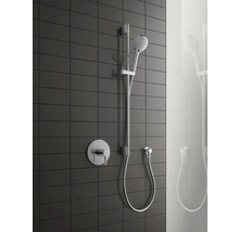 Duschsystem mit Handbrause, Brausestange und Aufputzarmatur vor dunklem Fliesenhintergrund