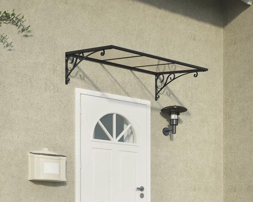 Haustürvordach mit filigraner Halterung über einer weißen Haustür