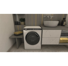 Badezimmer mit Waschmaschine, Waschbecken und Handtüchern