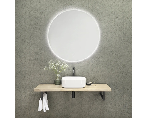 Badezimmer mit rundem Spiegel, Waschtisch und Aufsatzwaschbecken