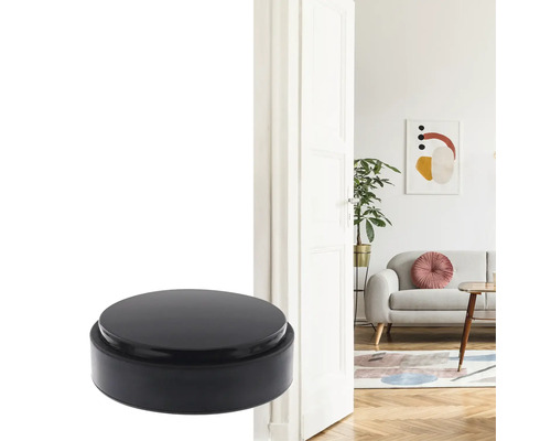 Schwarzer Türstopper vor einer geöffneten Tür