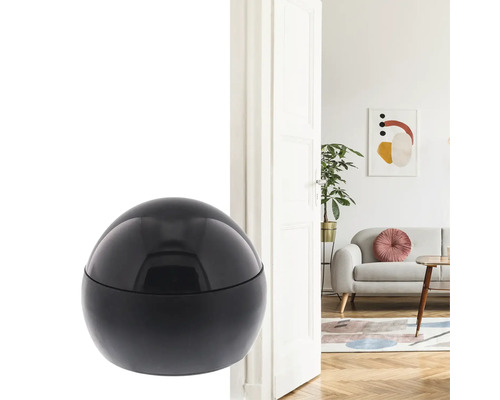 Schwarzer Türstopper in Kugelform vor offener Tür