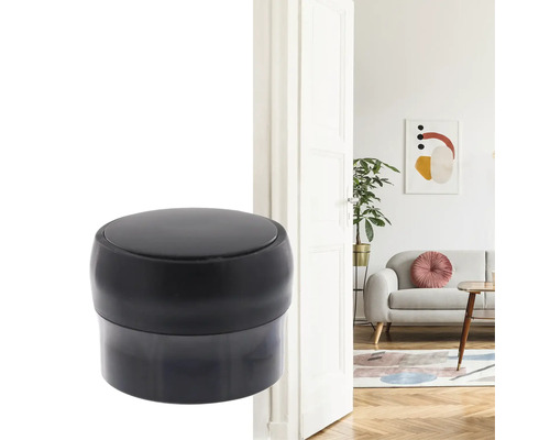 Schwarzer Türstopper vor einer geöffneten Tür