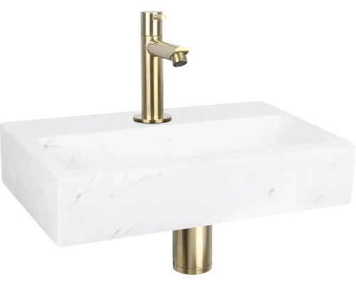 Waschtisch mit goldfarbener Armatur