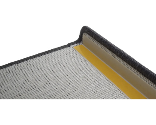 Detailansicht einer Treppenmatte mit Klebestreifen zur Befestigung.