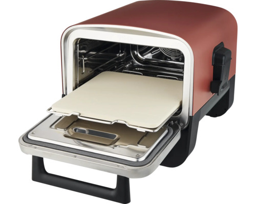 Pizzaofen mit offener Tür und Pizzastein