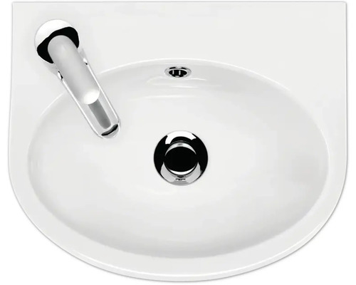 Aufsicht auf ein Keramikwaschbecken mit Armatur und Ablaufgarnitur