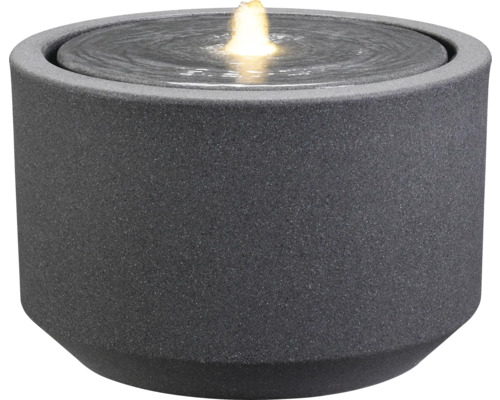 Grauer Zimmerbrunnen mit Wasserfontäne