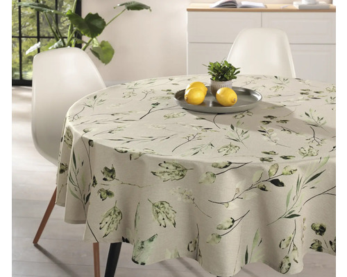 Runder Tisch mit Tischdecke mit Pflanzenmuster