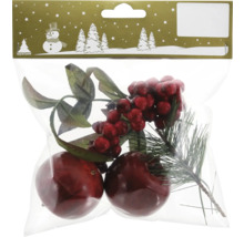 Verpackung mit Dekorationselementen: Zweige, rote Beeren und Kugeln.