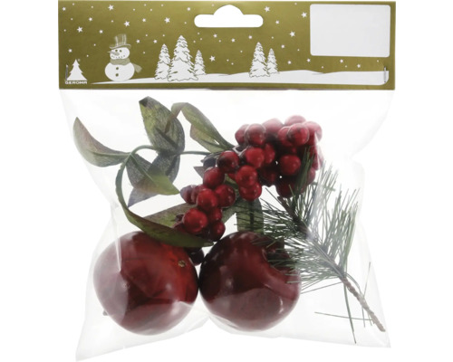 Verpackung mit Dekorationselementen: Zweige, rote Beeren und Kugeln.