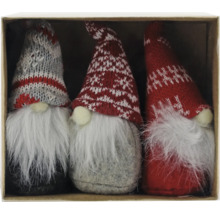 Drei Zwerge mit Strickmützen und langen Bärten in einer Schachtel