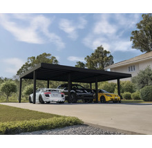 Carport mit drei geparkten Autos vor einem Haus