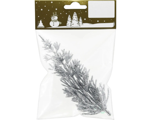 Glitzernder Tannenzweig in Verpackung als Weihnachtsdekoration