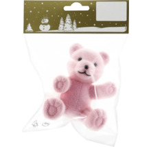 Rosa Teddybär als Dekorationsartikel in einer Plastikverpackung
