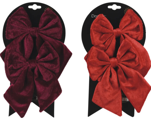 Zwei Deko-Schleifen aus Samt auf einer Verkaufsverpackung