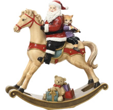 Weihnachtsdekoration mit Weihnachtsmann, Katze und Teddybär auf Schaukelpferd