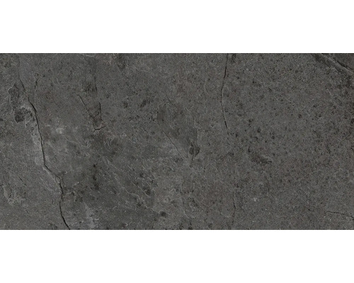 Nahaufnahme einer grauen Natursteinfliese mit rauer Textur.